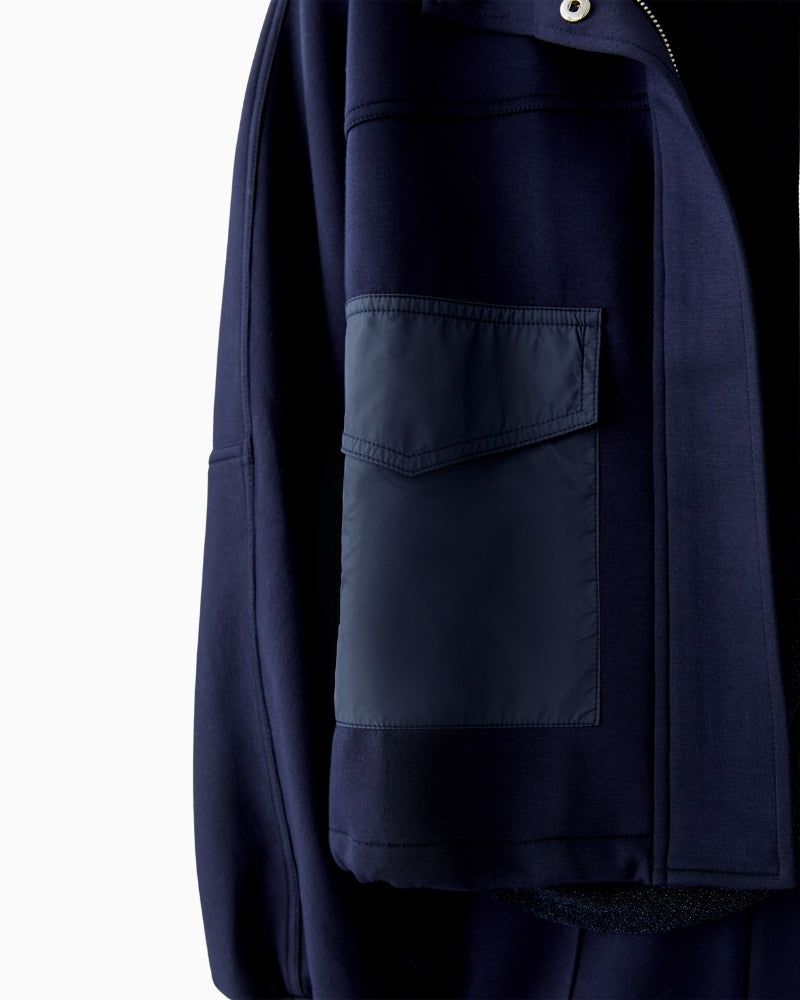Detail view of concealed zip and press-stud placket