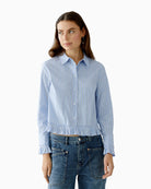 Oui light blue and white striped blouse with ruffle hem and cuffs