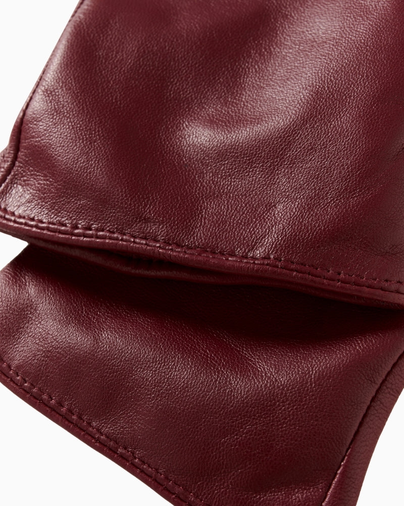 Close-up of black leather and suede women’s gloves