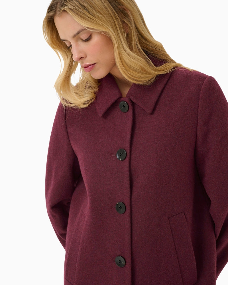 Close-up of rich port fabric and lapel detail on Part Two coat
