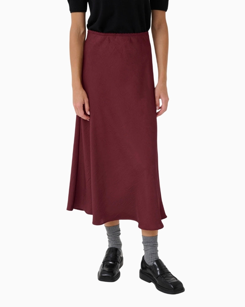 Midi skirt in Tawny Port by Part Two with glossy recycled fabric and A-line shape