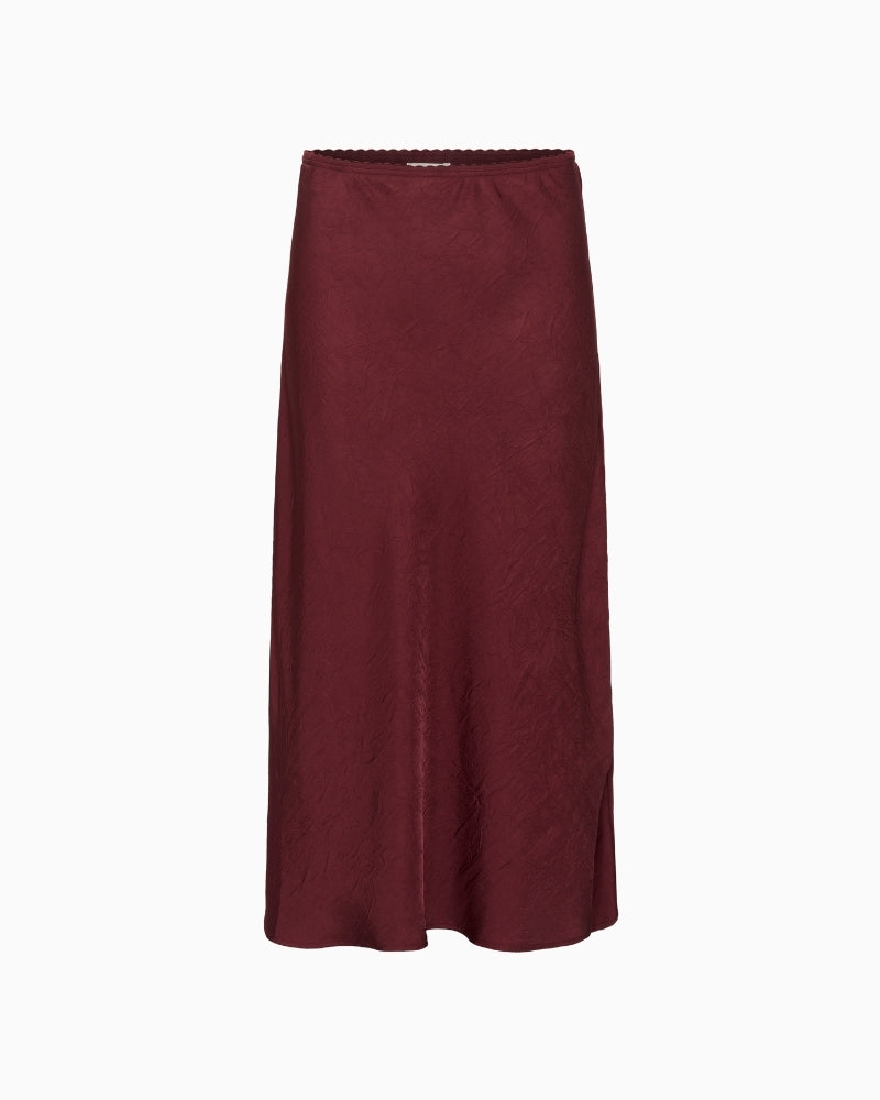 Midi skirt in Tawny Port by Part Two with glossy recycled fabric and A-line shape