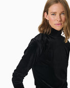 Close-up of luxurious stretch velvet fabric on Mone top