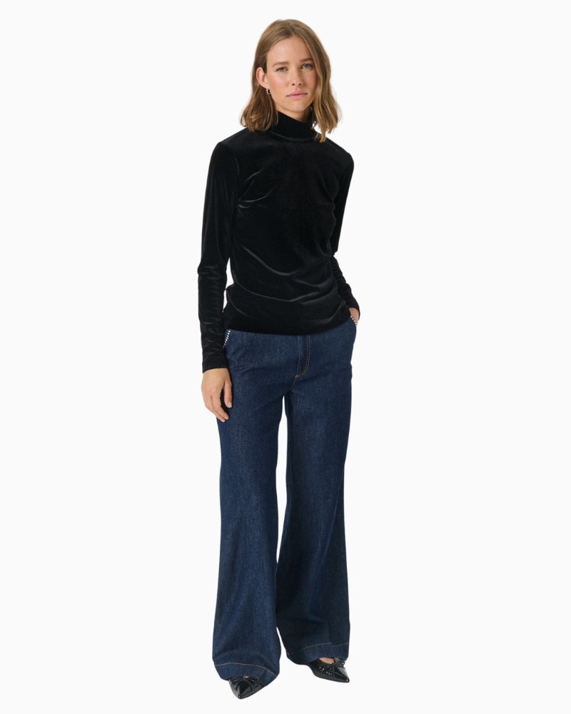 Front view of fitted velvet blouse showing feminine shape