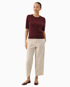 Pullover laid flat highlighting fit and ribbed trim detail