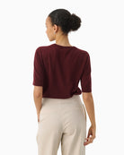 Back view of wool top with short sleeves and soft drape