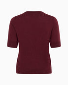 Back view of wool top with short sleeves and soft drape