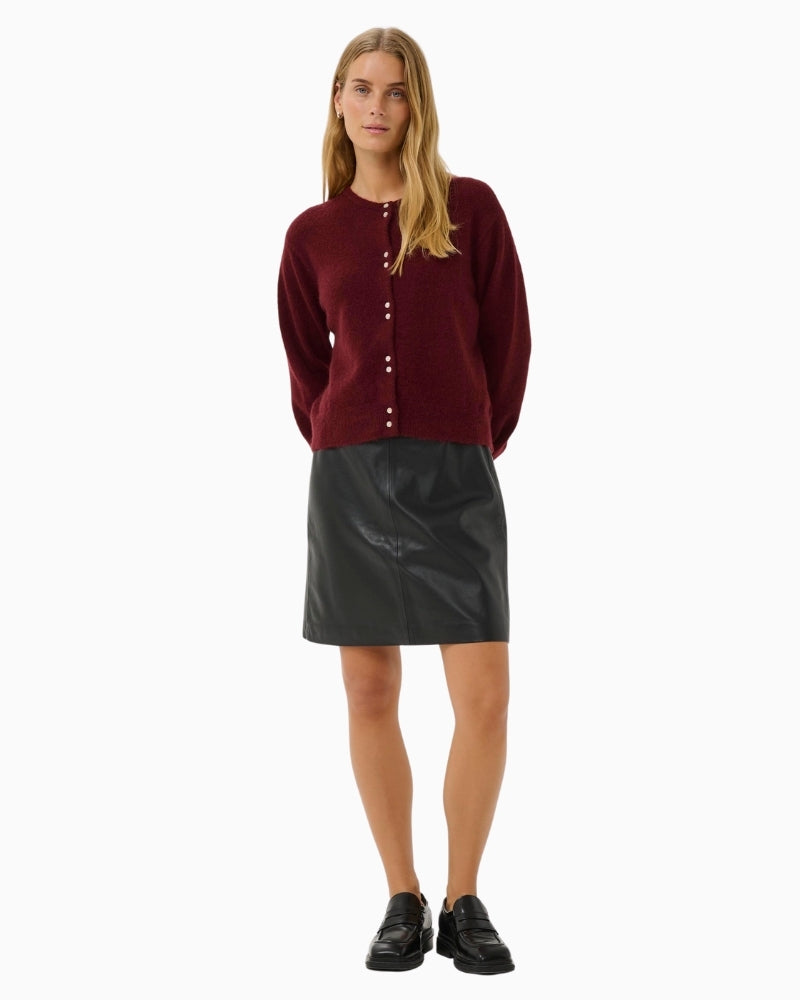 Front view of burgundy cardigan with mother-of-pearl buttons