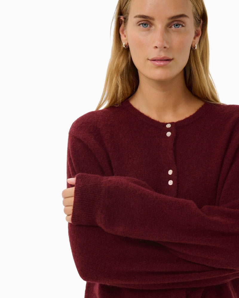 Close-up of soft fluffy knit texture in deep port