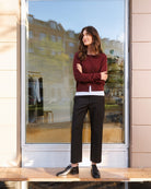 Part Two cardigan laid flat showing neckline, button closure, and soft wool texture