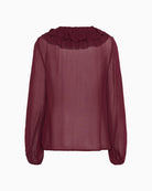 Back view of long-sleeve sheer burgundy blouse with soft drape