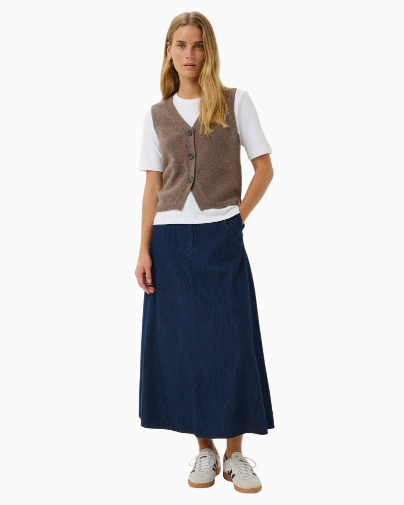 Layered styling of SylvaPW waistcoat over shirt for casual office look