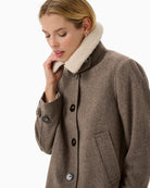 Close-up of fabric texture and lapel detail on Sylvia jacket