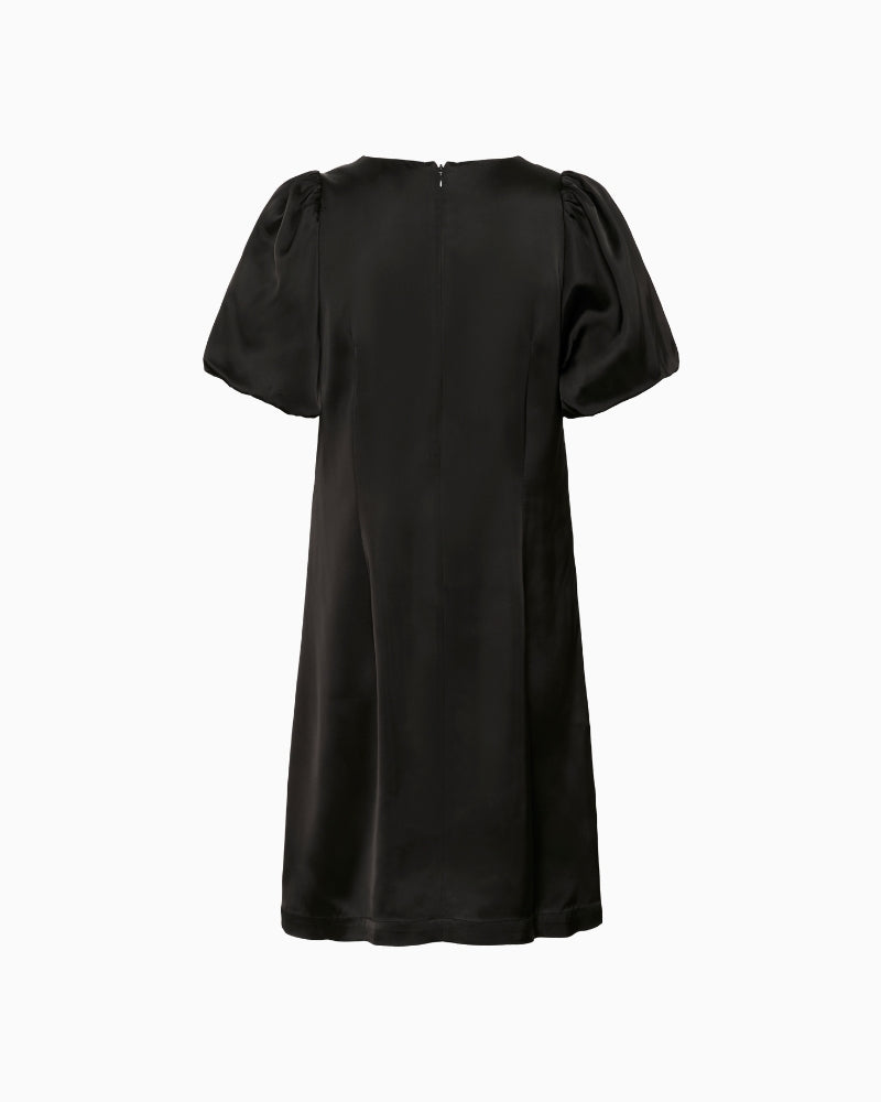 Back view of Ulva dress in black with minimal seam detail