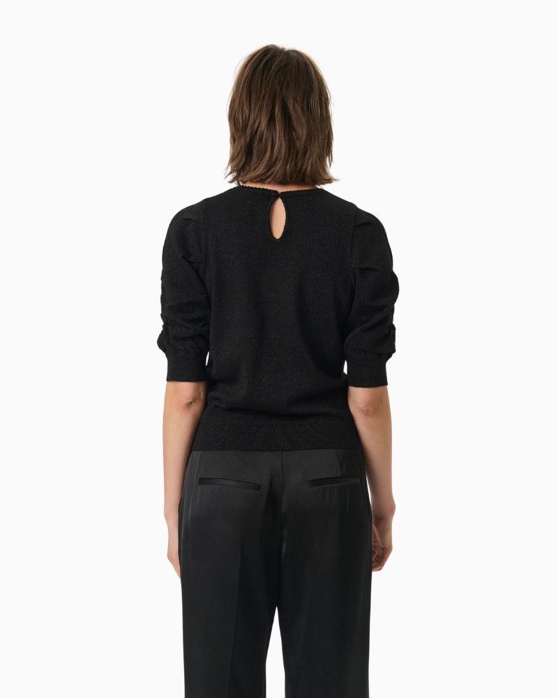 Back view of black shimmer blouse with regular fit and clean finish