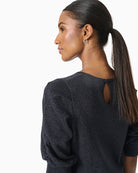 Close-up of fabric texture and round neckline on Varaia top