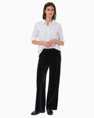 Model wearing Varlapw trousers styled with matching velvet blouse