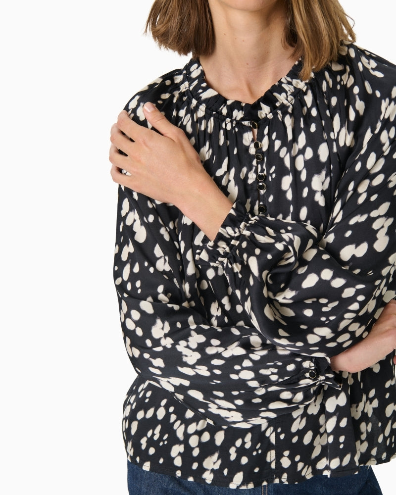 Close-up of soft viscose texture and classic collar