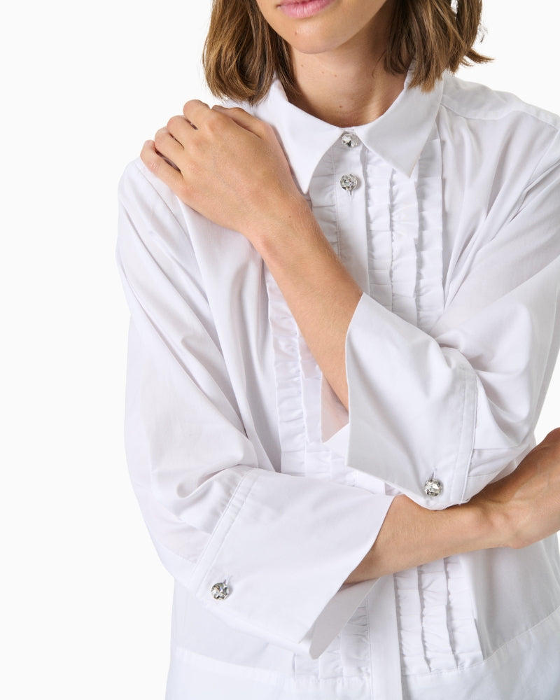 Close-up showing pleated button placket and mixed stripe direction