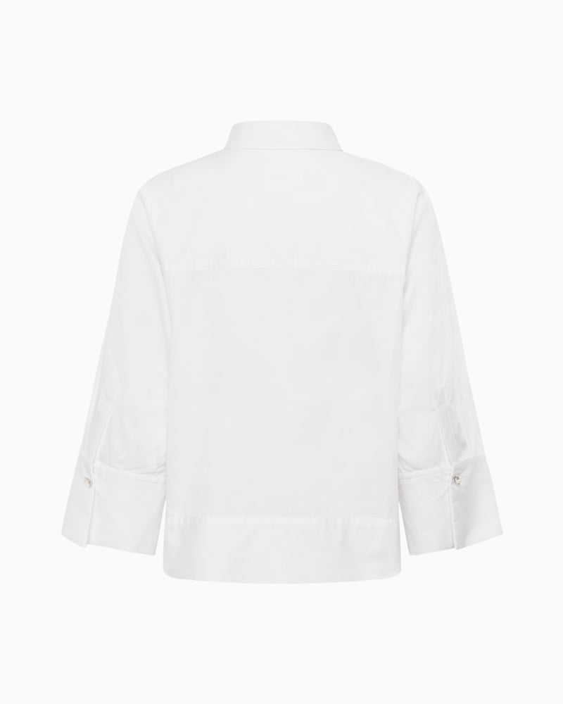 Back view of striped cotton shirt with dropped shoulders and soft structure