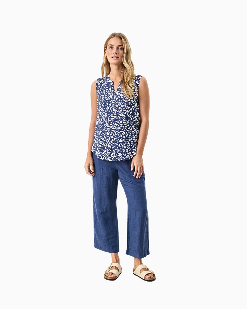 Casual summer look featuring navy floral print blouse and cropped denim trousers