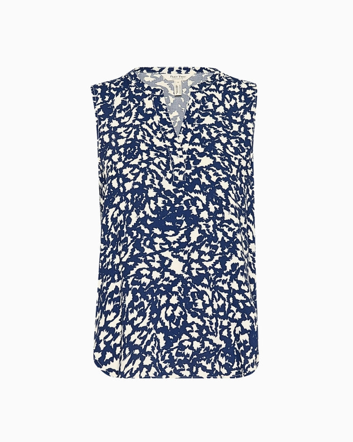 Flat lay of navy sleeveless floral blouse showing button placket and curved hem