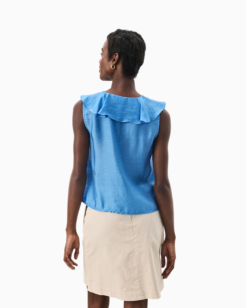 Back view of sleeveless blue blouse showing smooth fit and tailored finish