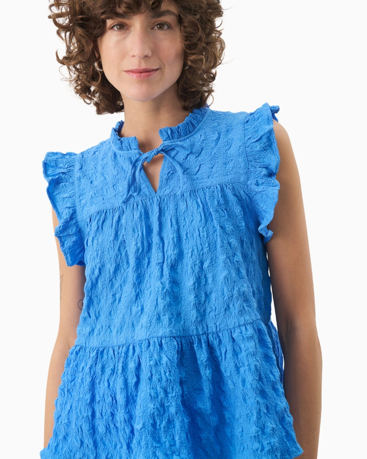 Close-up of ruffle edge and texture on Part Two sleeveless blouse