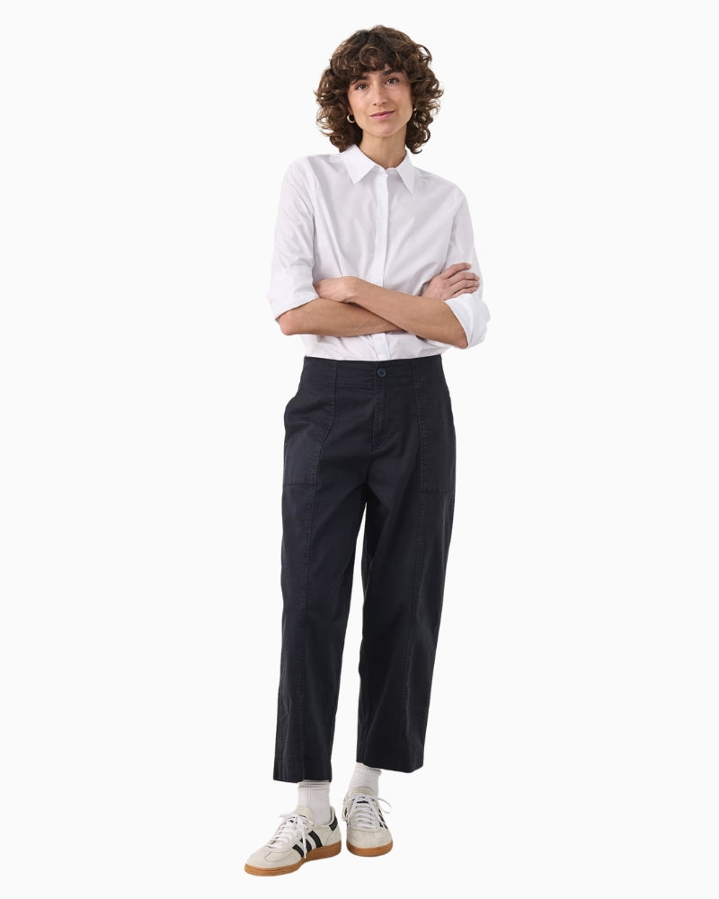 Full-length styled look with T-shirt and trainers