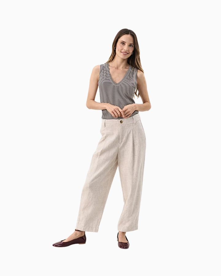 Full outfit view of wide-leg Netta trousers styled with a grey tank top