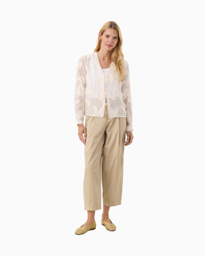 Full length view of model wearing cream Part Two long sleeve shirt with jeans