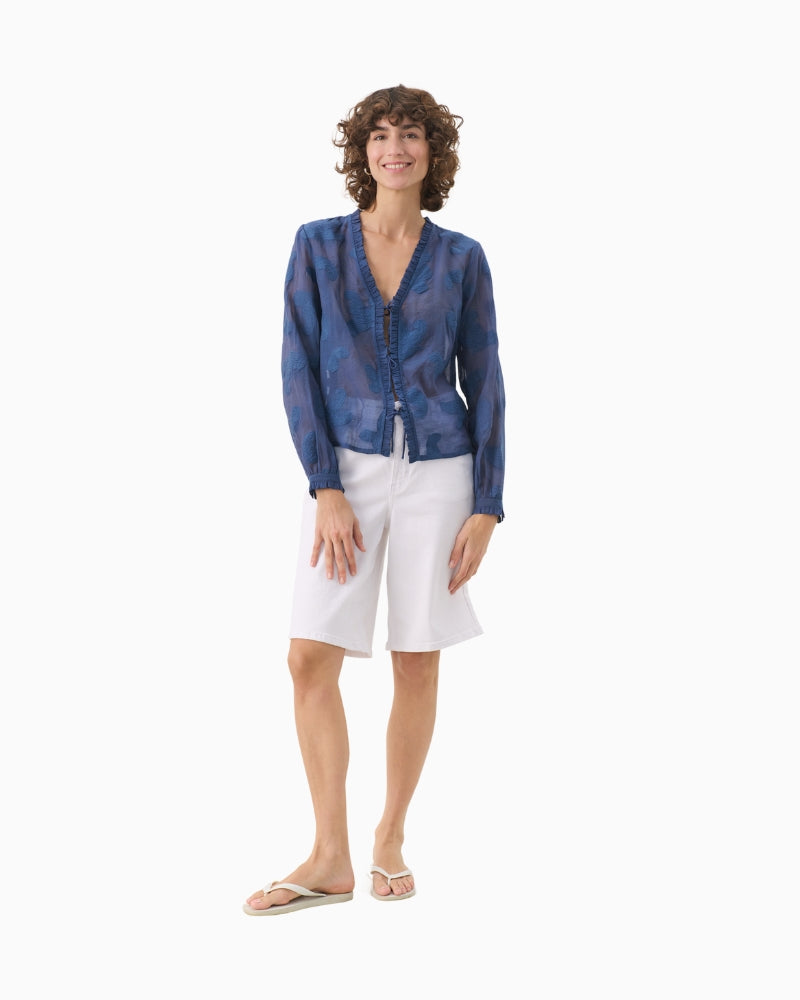 Full length view of model wearing oceana blue Part Two shirt with white shorts