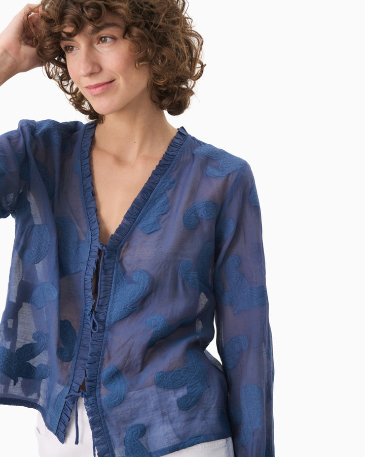 Close-up of collar and button detail on Part Two oceana blue shirt