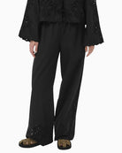 Part Two black wide leg trousers full length front view with cutwork hem