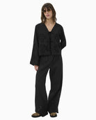Part Two black wide leg trousers full length front view with cutwork hem with matching shirt