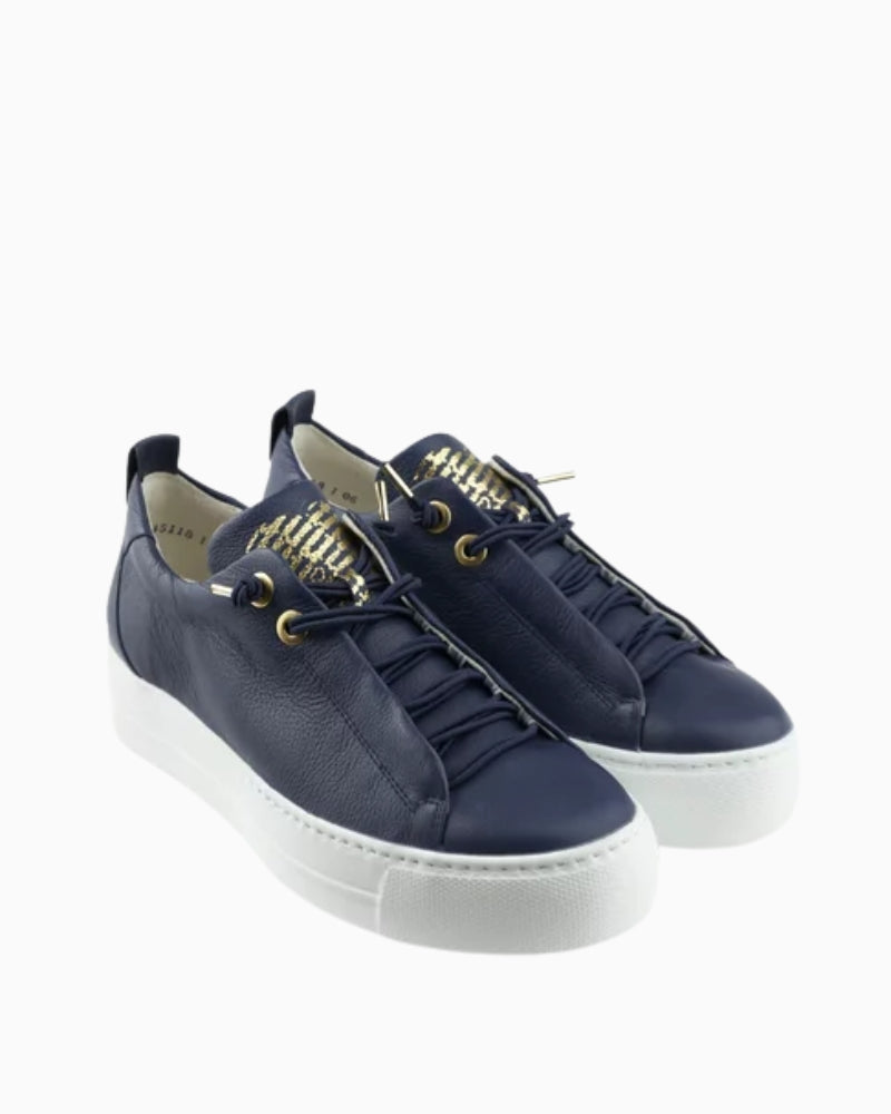 Side view of Paul Green Pauls navy leather trainers with white sole