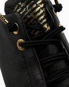 Close-up of smooth black leather and EVA outsole