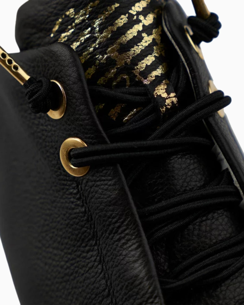 Close-up of smooth black leather and EVA outsole