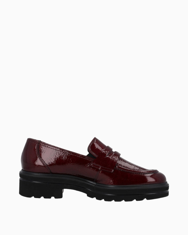 Side view of wine leather slip-on shoe by Paul Green with round toe and flat sole