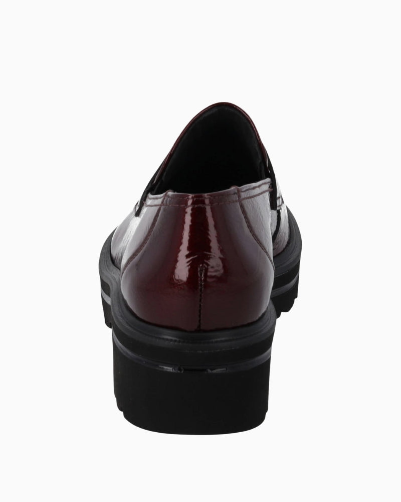 Back view showing reinforced heel and padded shaft edge on slip-on shoe