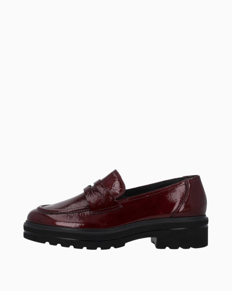 Side view of wine leather slip-on shoe by Paul Green with round toe and flat sole
