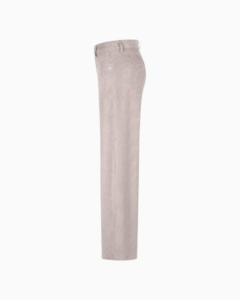 Side view of soft ribbed corduroy trousers with patch pockets
