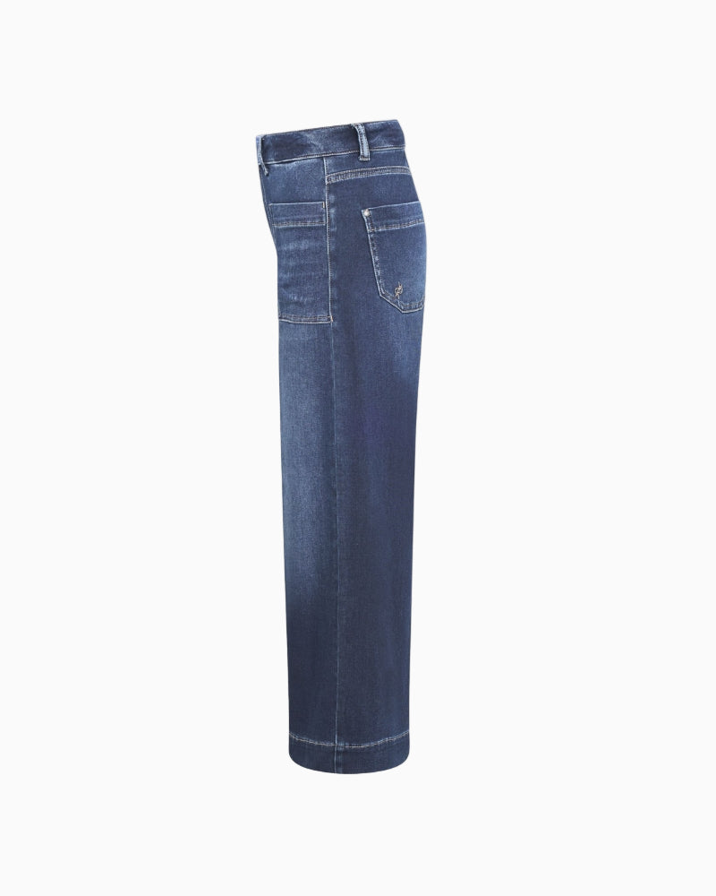 Side view showing cropped wide-leg and pockets of Miru 6/8 denim trousers
