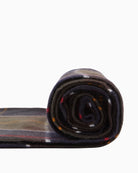 Rolled Barbour Hailestartan scarf showing layered tartan spiral pattern