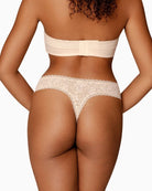 Back view of seamless lace thong showing smooth, invisible design