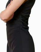 Close-up detail of SPELL black mini dress ruching and fabric texture – Áines Boutique