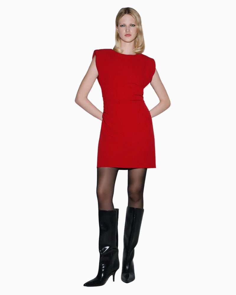 Woman wearing SPELL red mini dress paired with boots – Áines Boutique