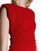 Close-up of SPELL red mini dress ruching and fabric texture – Áines Boutique