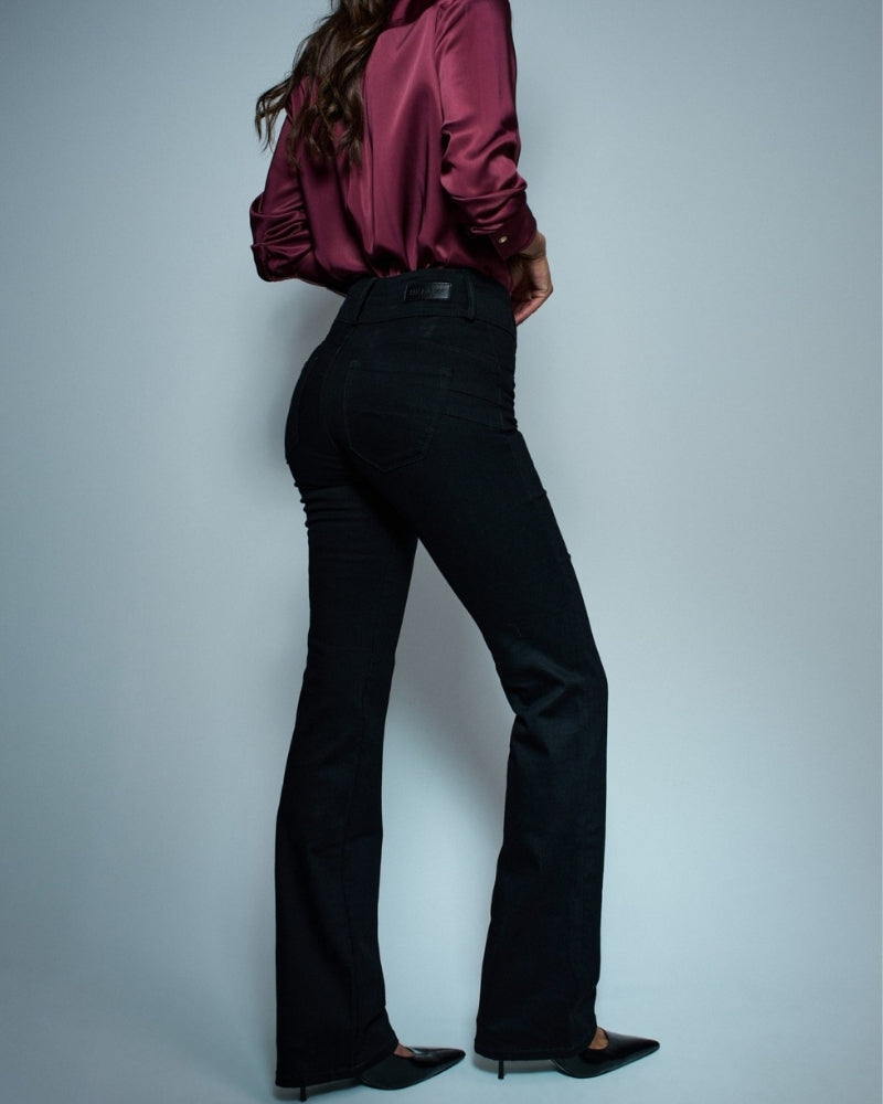 Side view of Secret Silhouette jeans showing push in shaping effect