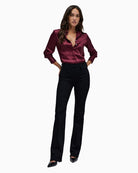 Model wearing Salsa black Push In bootcut jeans styled with heels